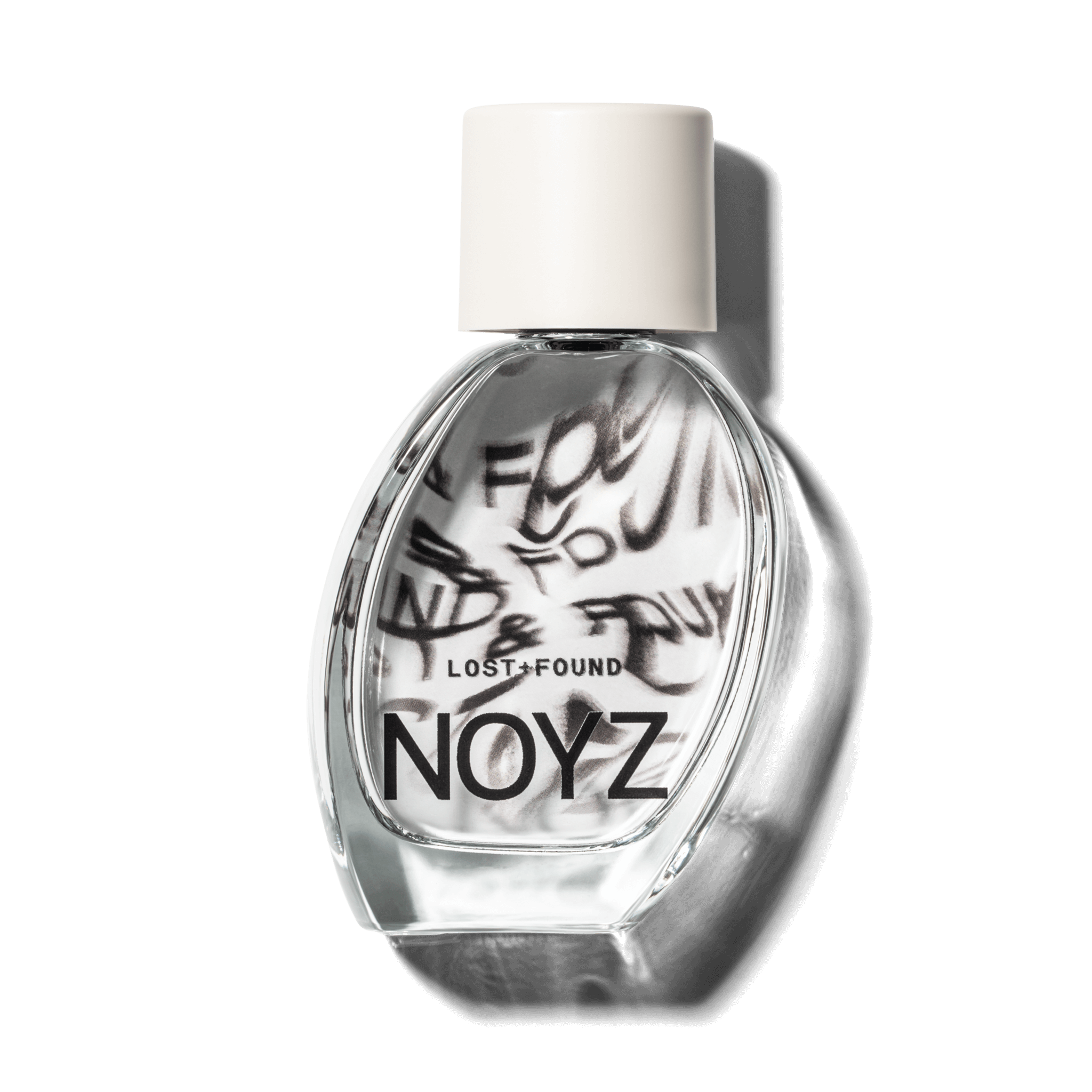 A glass bottle of NOYZ perfume Lost & Found with citrus scent. Discover the best unisex scents.