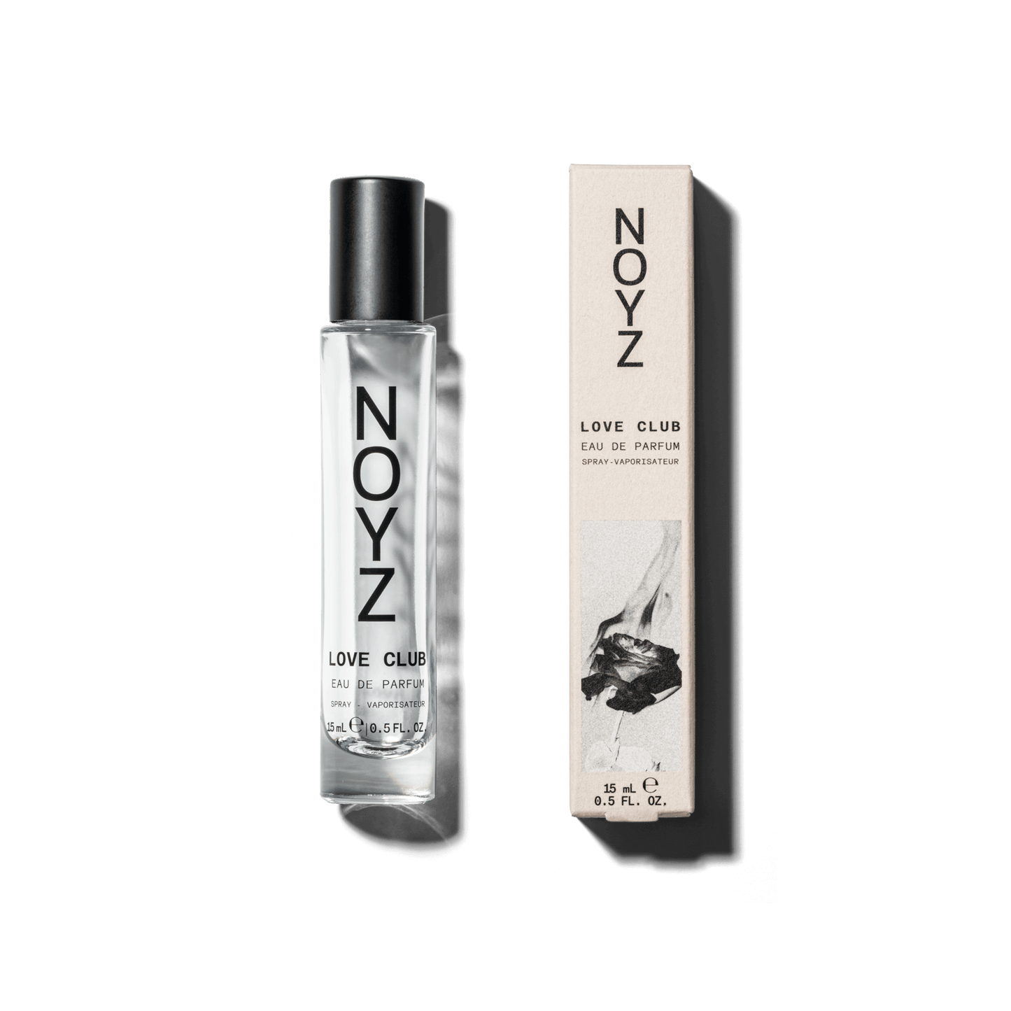 A small glass bottle of Noyz Love Club perfume sits alongside its packaging box