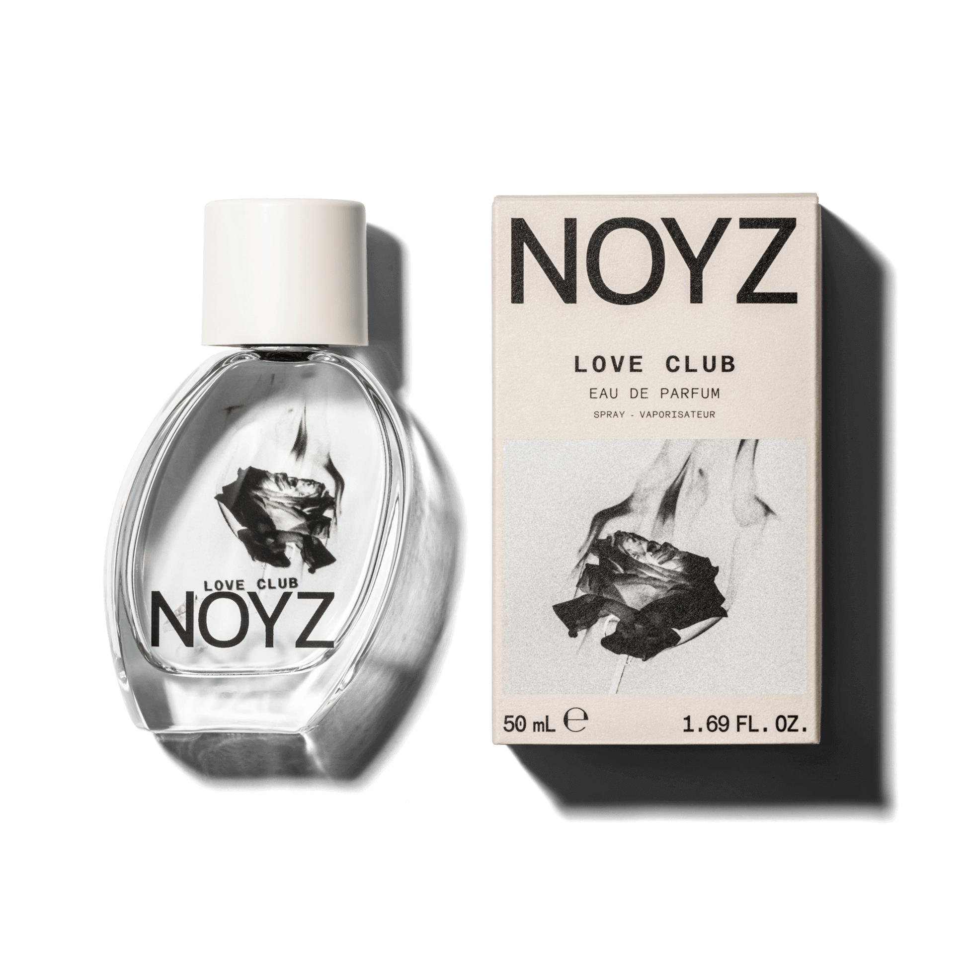 An asymmetrical glass bottle of Noyz Love Club perfume and a box of its sustainable packaging