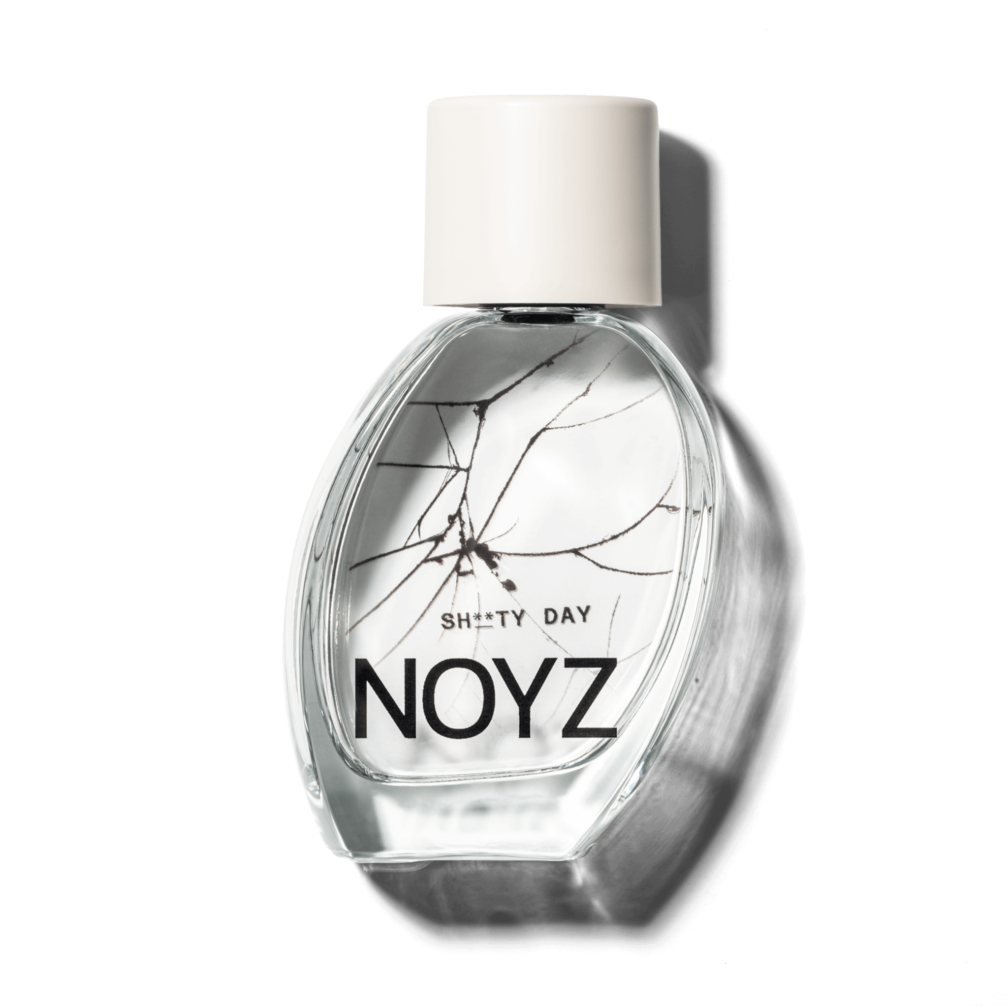A bottle of NOYZ perfume Sh**ty Day with scent notes of amber and sage. Discover the best summer scents.