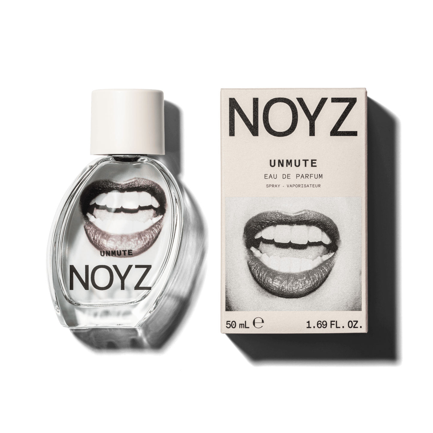 An asymmetrical glass bottle of top unisex fragrance Unmute by NOYZ next to a box of its FSC certified packaging