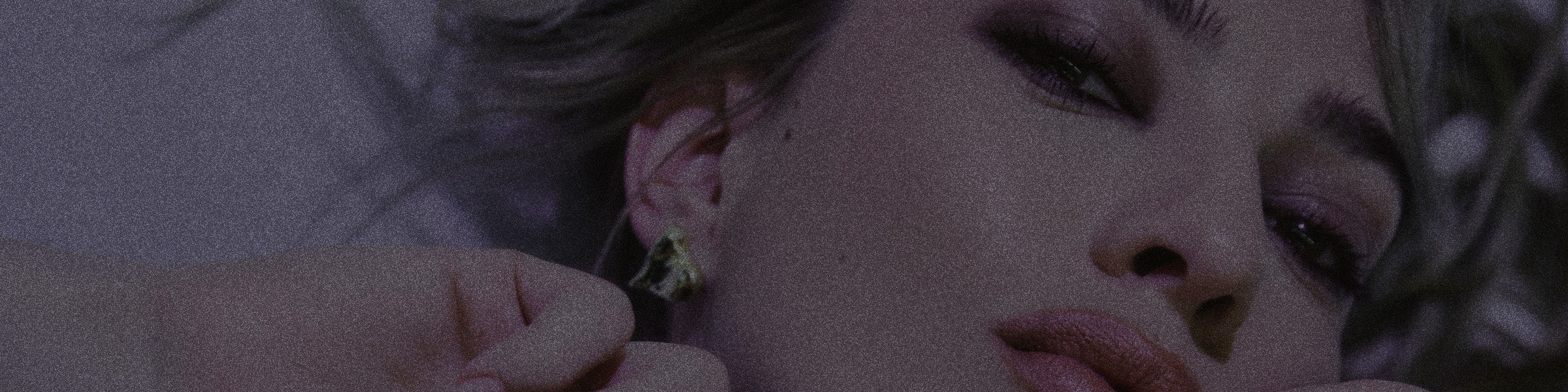Close up photo of a woman modeling for NOYZ unisex fragrance