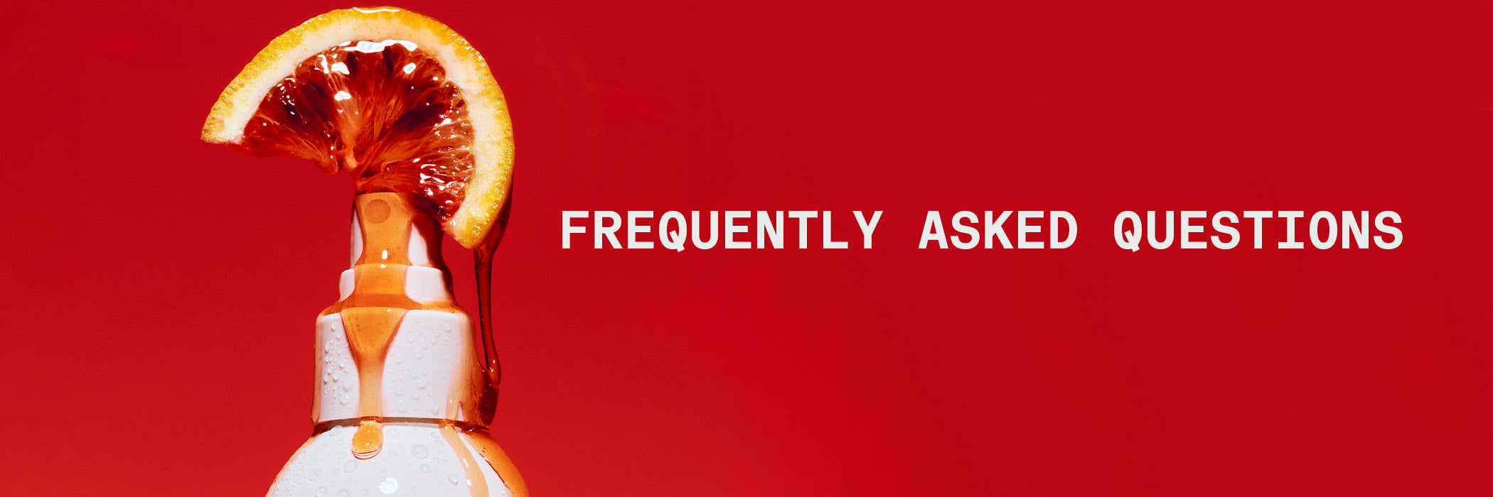 Fizzy bottle with a slice of orange on a red background with 'Frequently Asked Questions' text.