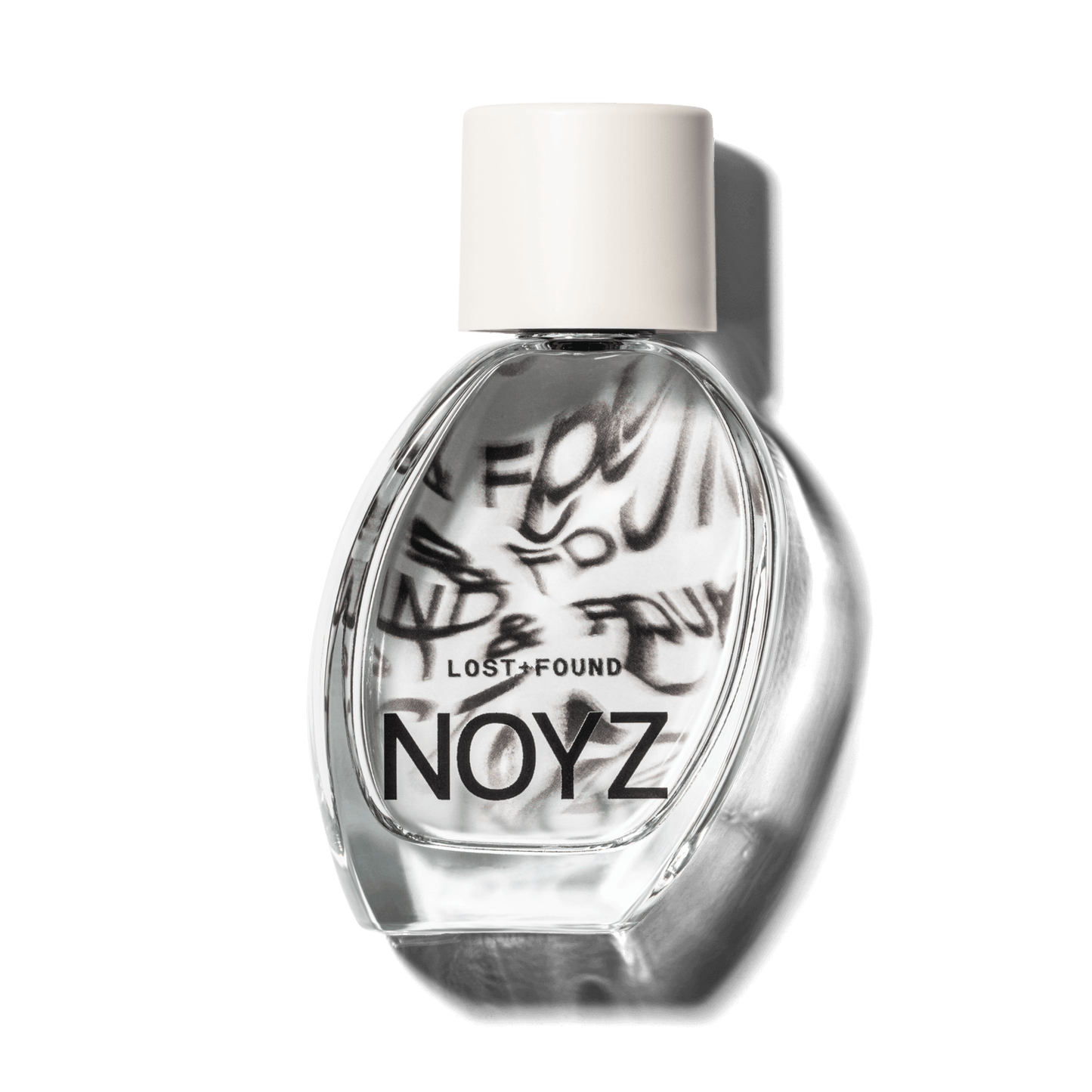 A glass bottle of NOYZ perfume Lost & Found with citrus scent. Discover the best unisex scents.