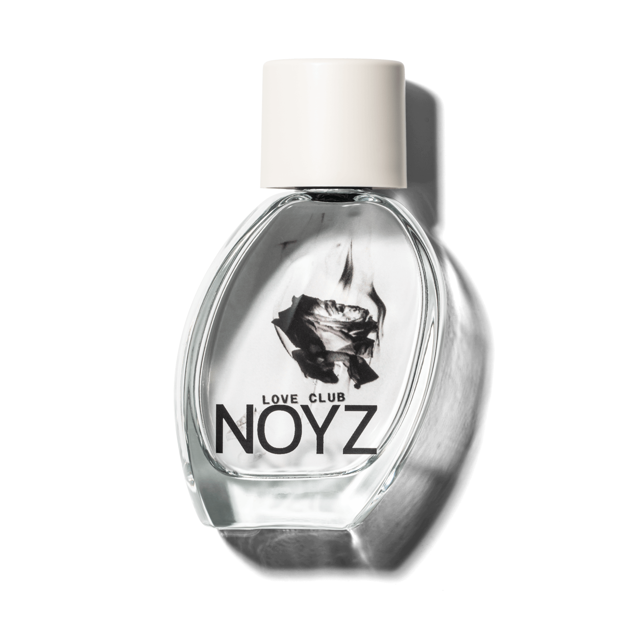 A slightly leaning, glass bottle of NOYZ Love Club, a sustainably crafted, fresh perfume