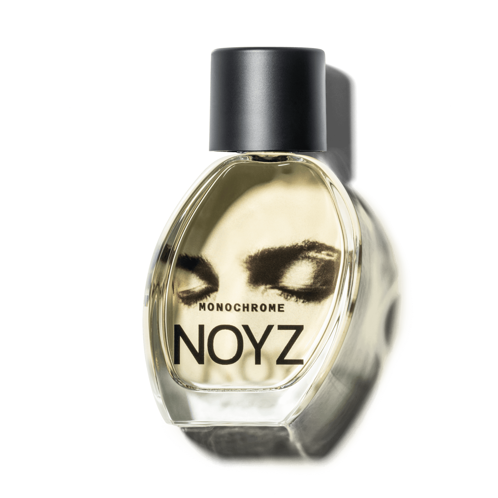 A glass bottle of NOYZ Monochrome unisex perfume by Damon Baker a floral woody scent.