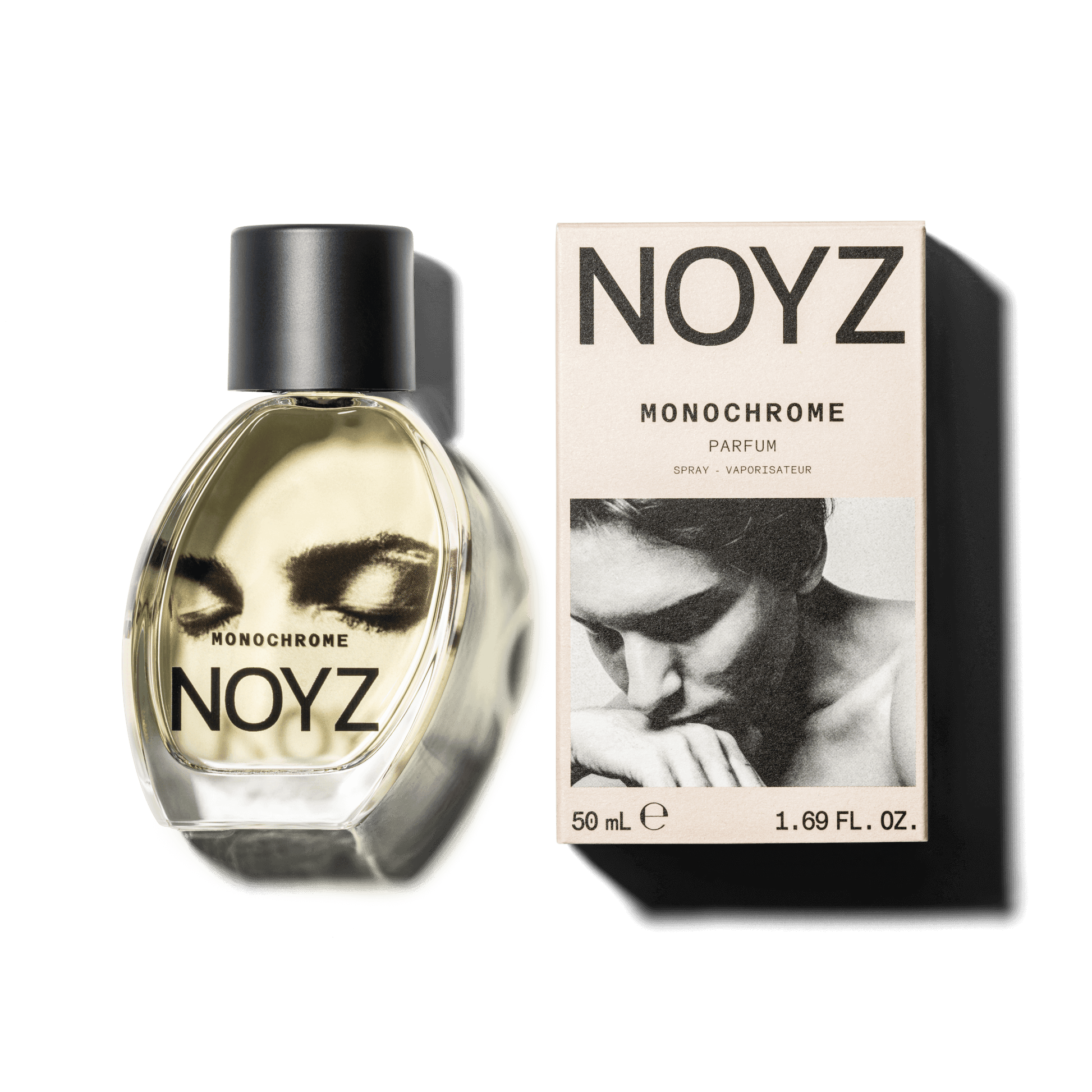 An asymmetrical glass bottle of Noyz Monochrome perfume and a box of its sustainable packaging