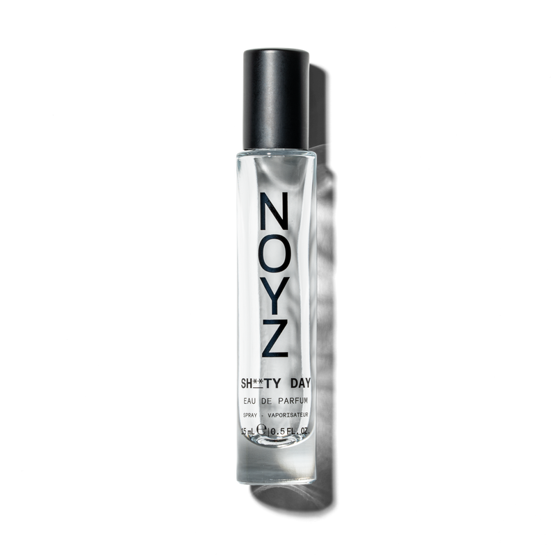 A small 15 ml glass bottle of NOYZ Sh**ty Day top unisex fragrance